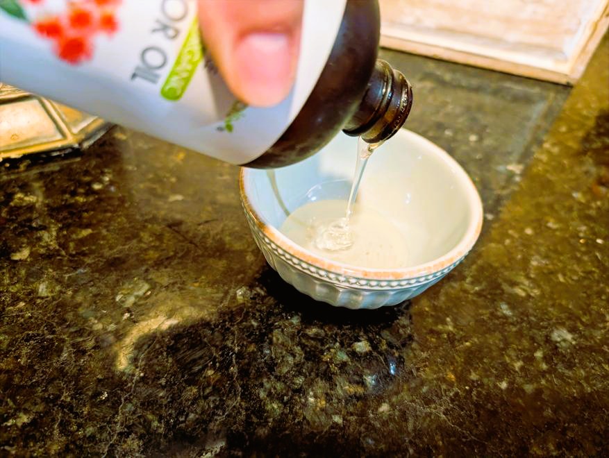 organic castor oil in glass bottle.
